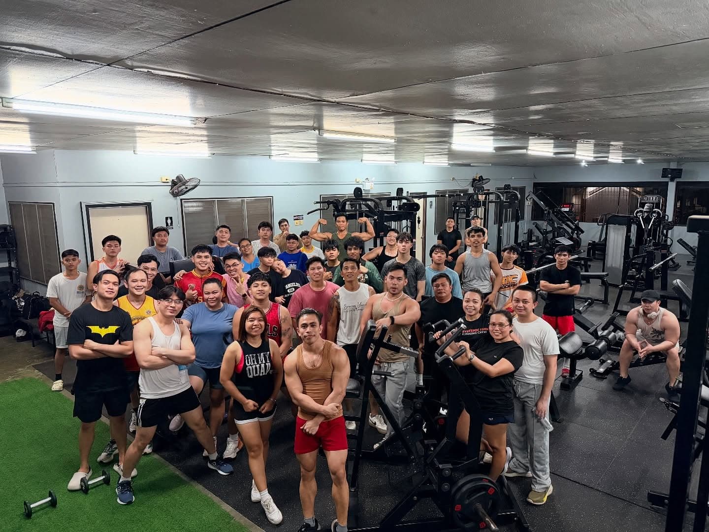 Project-E members together inside the gym