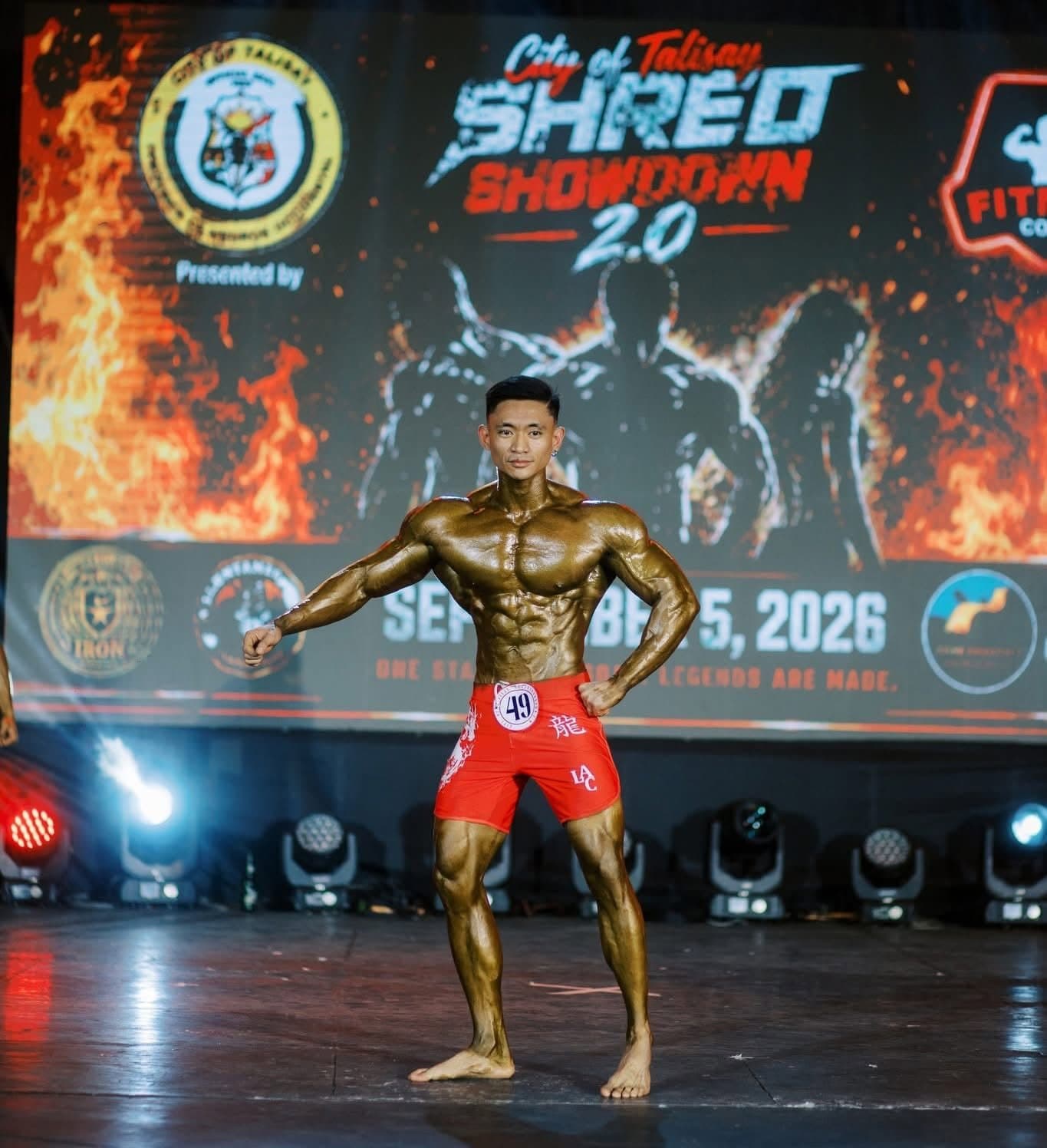 Coach Eric posing in red board shorts at Shred Showdown 2.0